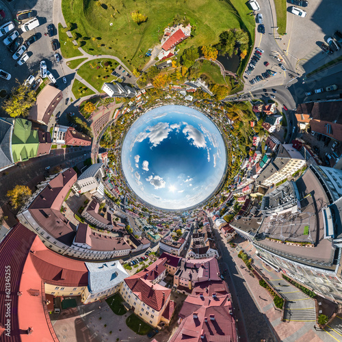 blue sphere inside overlooking old town, urban development, historic buildings and crossroads. Transformation of spherical 360 panorama in abstract aerial view.