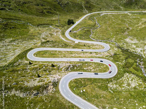 The winding roads over the Julier Pass of Swiss Alps mountains in summer photo