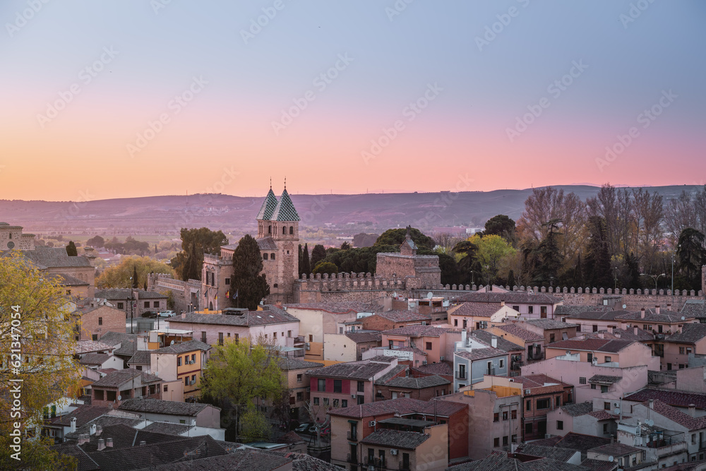 Toledo Skyline at sunset with Puerta de Bisagra Nueva Gate - Toledo, Spain