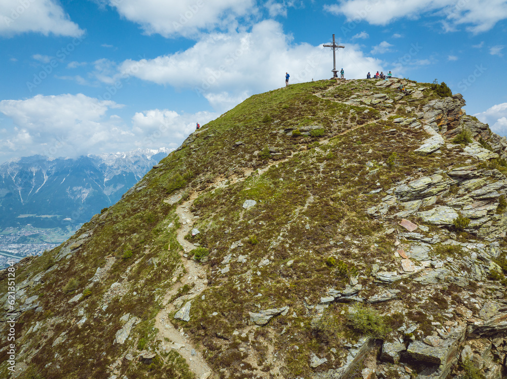 Fototapeta premium Aerial view of a mountain summit near the City of Innsbruck in the austrian alps in the region of Tyrol, Austria.