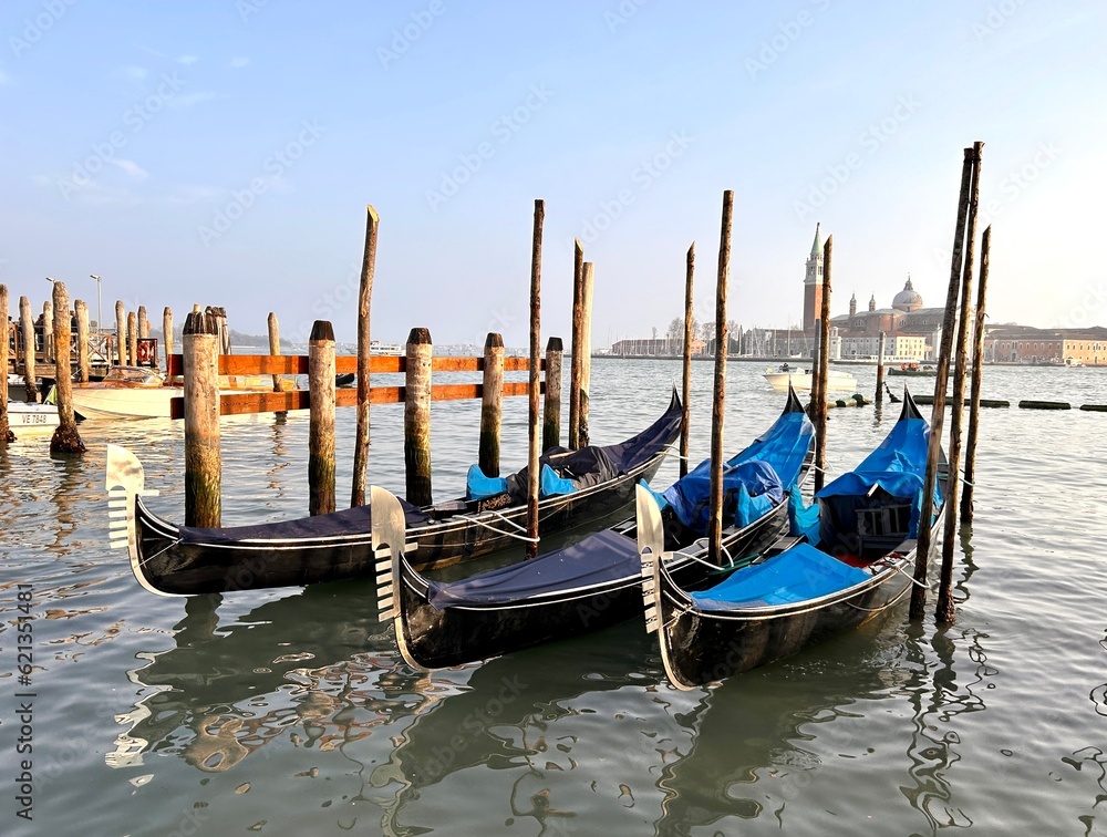 Blue gondolas on water canal in Venice 