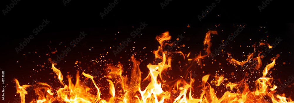 Fire flame with sparks on black background Fire flame with sparks on black background
