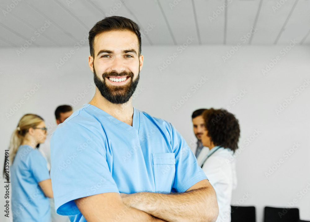 Obraz premium doctor nurse portrait man hospital group team medical uniform health surgeon adult stethoscope smiling professional clinic medicine male happy female occupation teamwork care