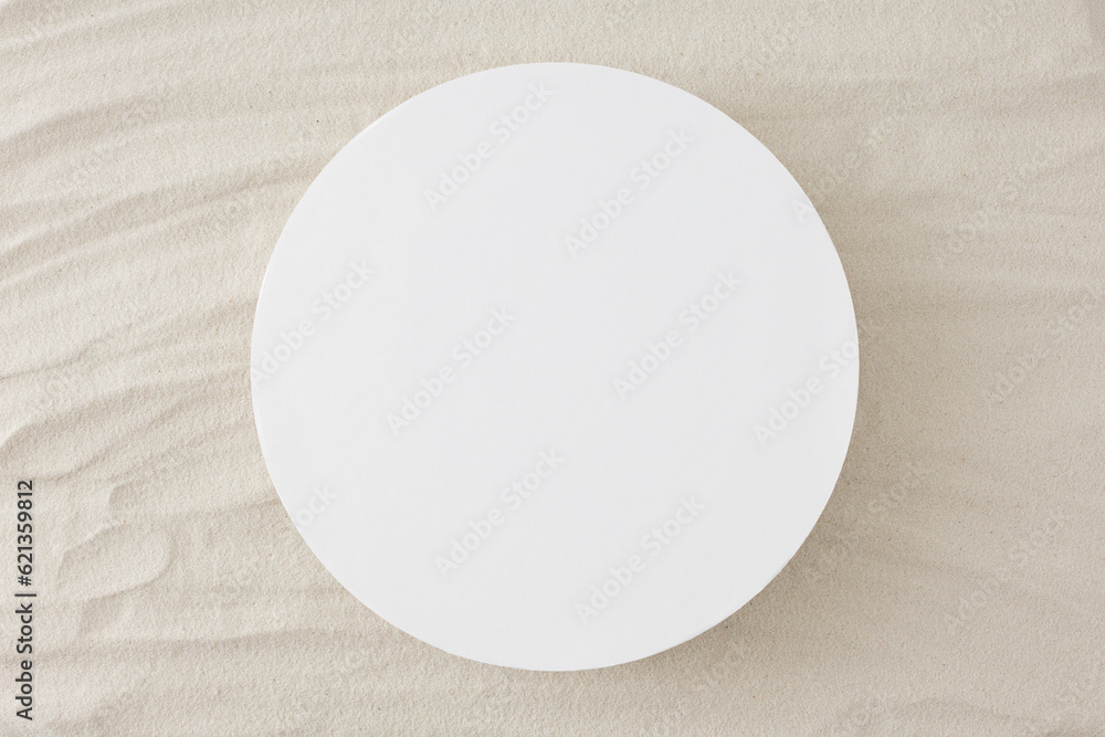 Tropical beach concept. Top view photo of empty round frame on the sand on isolated background with empty space for text or promotions Tropical beach concept. Top view photo of empty round frame on the sand on isolated background with empty space for text or promotions