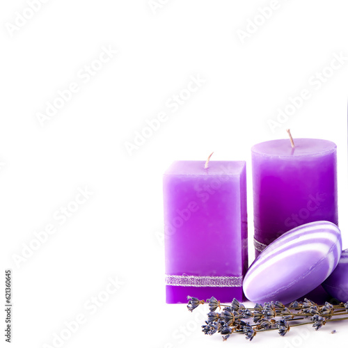 Lavender scented candle and soap isolated on white .