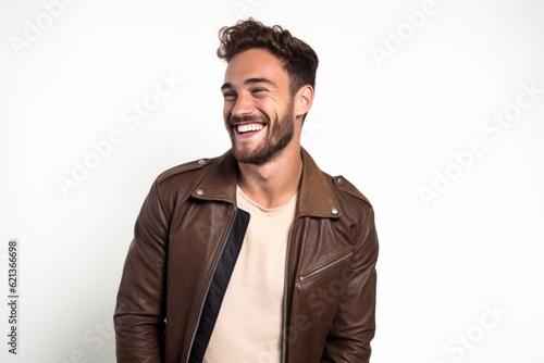 Portrait of a smiling young man in leather jacket on white background