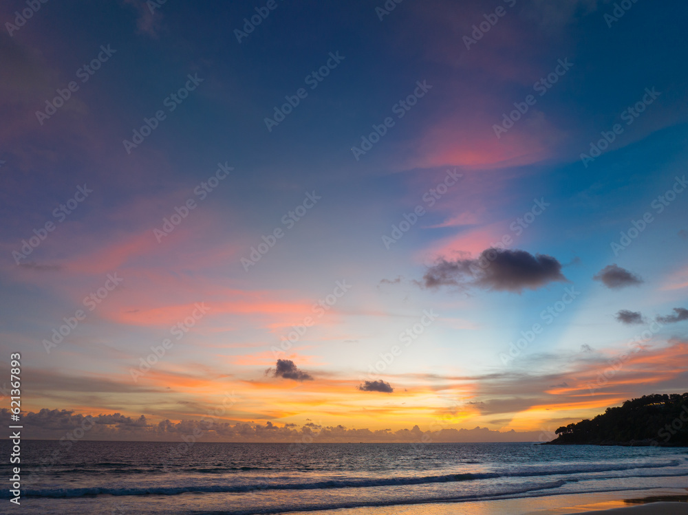 Naklejka premium Aerial panorama view scene romantic pink sky on sunset at Karon beach. .abstract nature background..Sunset with bright pink light rays and other atmospheric effects. .abstract nature background.