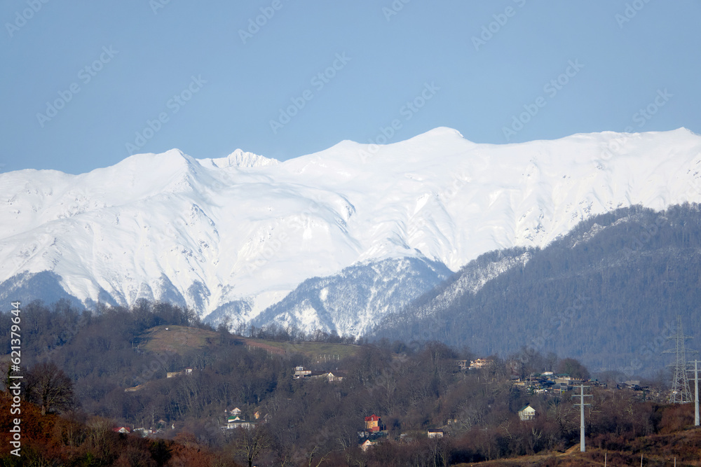 Panoramic view of the Caucasus mountain range from Adler, Russia. Mountains Rosa Khutor.