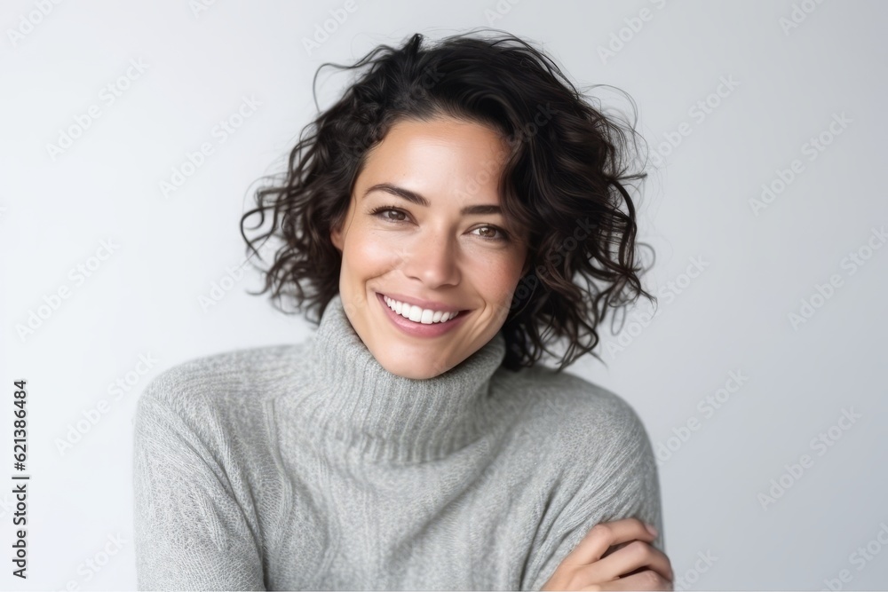 Portrait of a smiling woman looking at the camera over white background Portrait of a smiling woman looking at the camera over white background