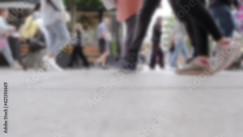 blurred, defocused people, youth walking in daytime summer Frankfurt, feet of pedestrians walking close up, Zeil street, European population, urban lifestyle, cityscape photography photo