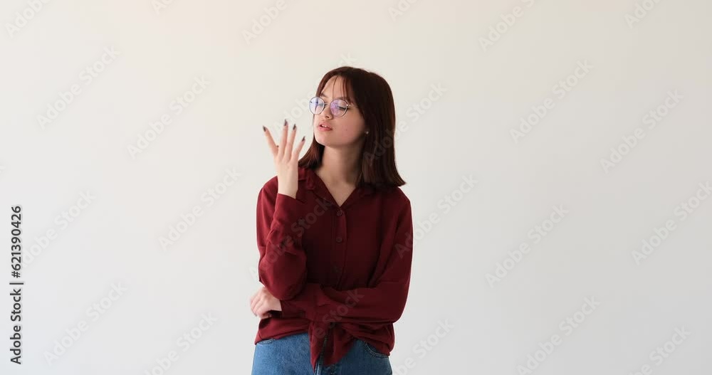 Caucasian teenage girl on white backdrop. With a furrowed brow and eyes filled with introspection, she carefully weighs her options, seeking clarity in her decision-making process. Caucasian teenage girl on white backdrop. With a furrowed brow and eyes filled with introspection, she carefully weighs her options, seeking clarity in her decision-making process.
