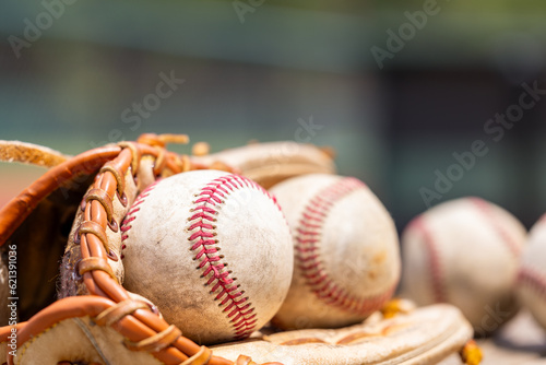 Used Baseballs in glove for sports background with copy space