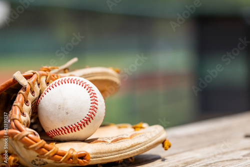 Used Baseball in glove for sports background with copy space