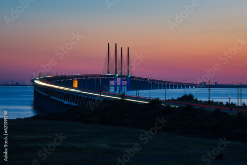 The Oresund Bridge is a combined motorway and railway bridge between Sweden and Denmark  Malmo and Copenhagen .