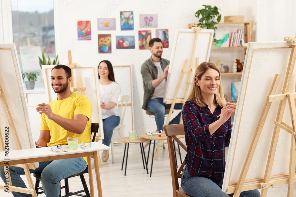 Group of students attending painting class in studio. Creative hobby Group of students attending painting class in studio. Creative hobby