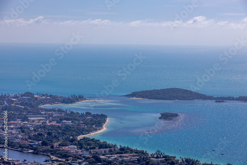 panoramic background of high mountain scenery, overlooking the atmosphere of the sea, trees and wind blowing in a cool blur, spontaneous beauty photo