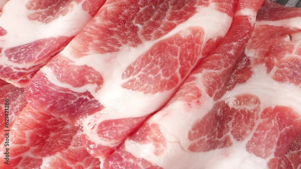 The camera moves across the surface of the pork neck slice, viewers can observe the delicate striations of muscle, the interplay between lean meat and fat, and the texture of the meat fibers.
The camera moves across the surface of the pork neck slice, viewers can observe the delicate striations of muscle, the interplay between lean meat and fat, and the texture of the meat fibers.