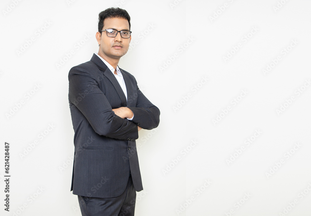 Young indian businessman wearing suit standing cross arms isolated over white background. Corporate Concept. Young indian businessman wearing suit standing cross arms isolated over white background. Corporate Concept.