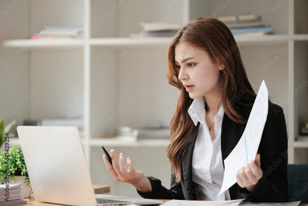 Beautiful woman doing video conference online via laptop computer, presenting business growth graph and discussing with her colleague at office. Beautiful woman doing video conference online via laptop computer, presenting business growth graph and discussing with her colleague at office.
