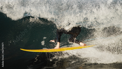 close up of surfing a big wave