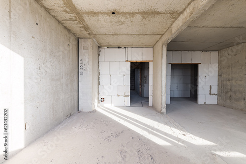 Empty concrete commercial space without finishing with partitions