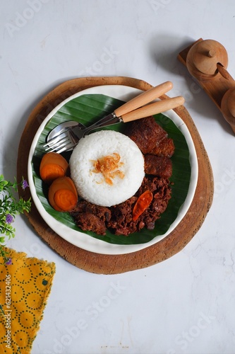 A plate of white rice and gudeg Jogja photo