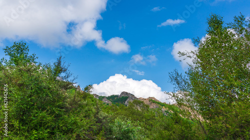 Beautiful thick clouds over rock in the blue sky