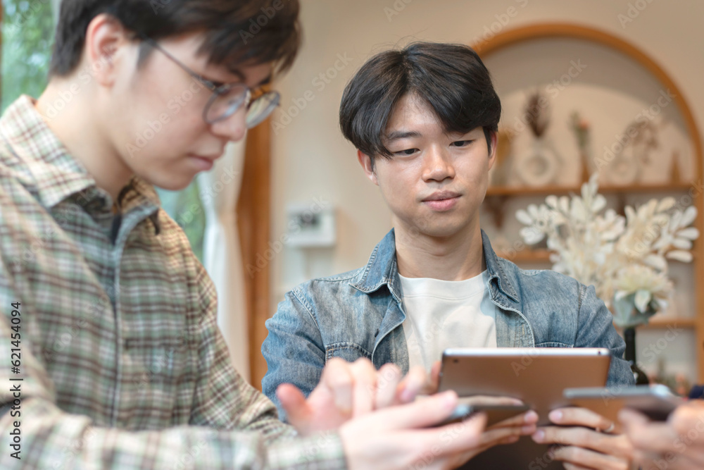 Portrait of young adult businessman which is so serious and unhappy about his business, he is talking and consulting with his friend, digital namad and working problems concept.