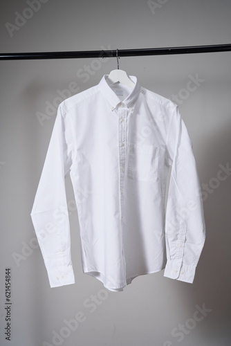 Whitebutton up shirt mockup, school uniform. gray background, studio shot. Mock up for design and branding logo, close up