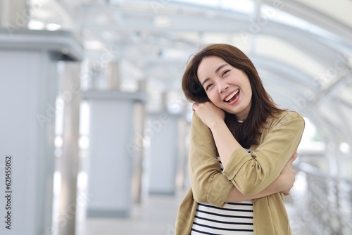 Free Download Beautiful Asian woman in casual style standing hugging herself ,Positive self love and self care concept. - GFXLoad