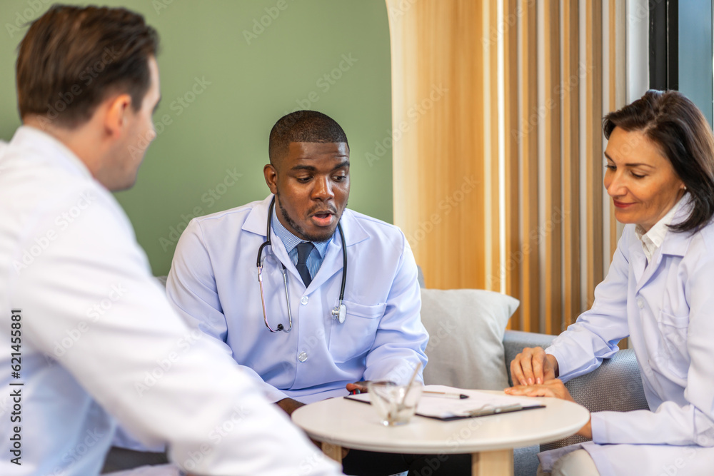 Group of professional medical doctor team meeting training medical in uniform working discussing and talk with patients record, teaching medic team, sit in hospital.health medical care concept Group of professional medical doctor team meeting training medical in uniform working discussing and talk with patients record, teaching medic team, sit in hospital.health medical care concept