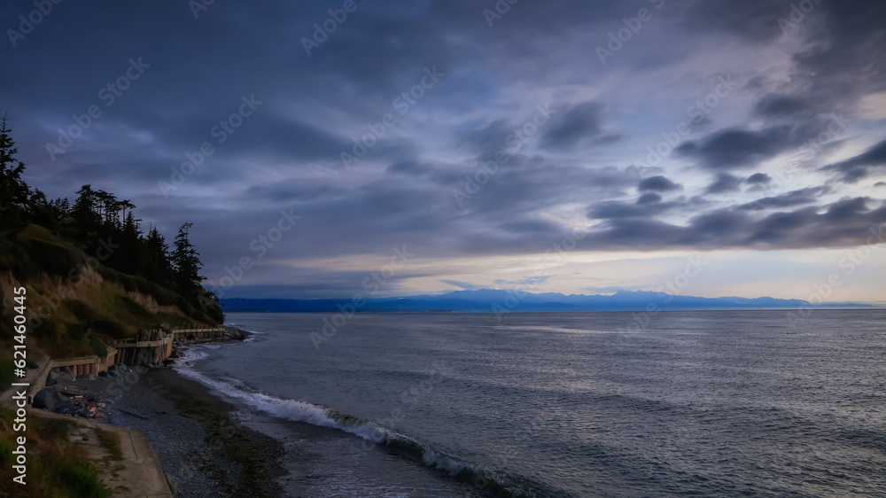 Overcast sky along Pacific coast in Washington state during dusk.