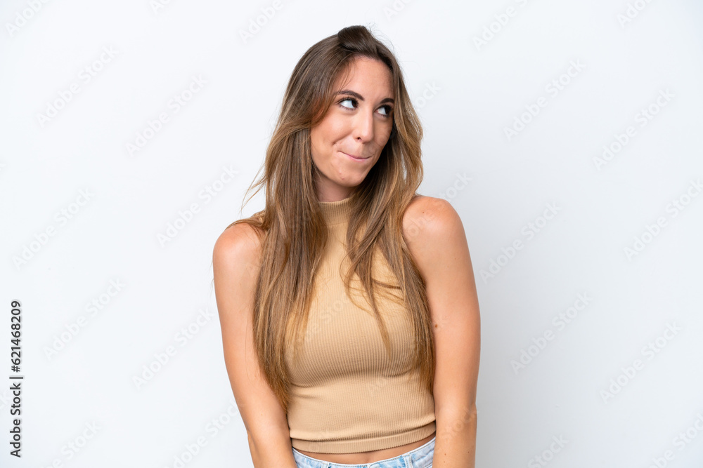 Young caucasian woman isolated on white background having doubts while looking up Young caucasian woman isolated on white background having doubts while looking up