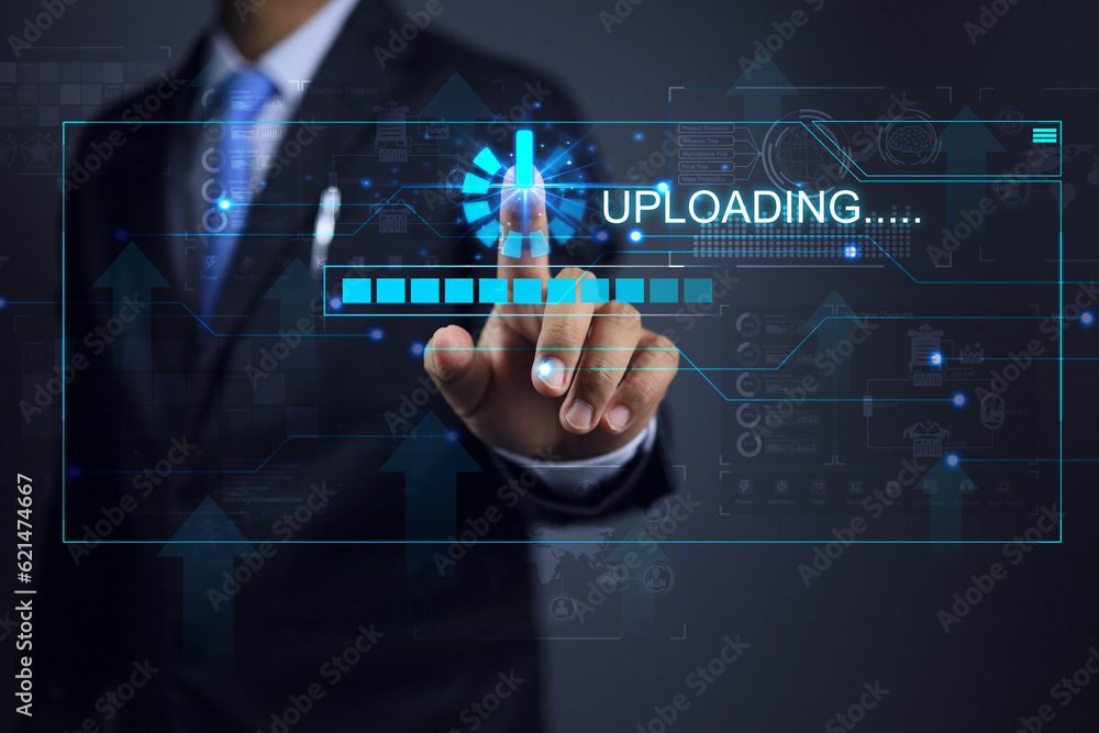 Obraz premium Businessman touch to upload data via virtual screen such as digital document data, website data or industrial machine operation data for big data storage, data backup cloud computing concept