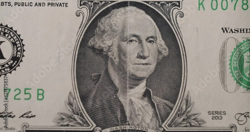 US President Washington on United States. American one dollar paper banknote in close up macro. One USD cash macro view. 1 Dollar Cash Stop Motion. 1 Dollar Closeup. Stop Motion of 1 USD Bills. photo