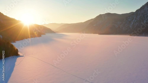 Altai mountains in winter: Dawn on the Teletskoye Lake. Aerial view.