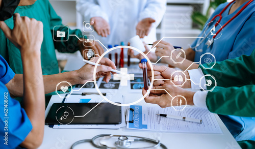 Medical technology network team meeting concept. Doctor hand working with smart phone modern digital tablet and laptop computer with graphics chart interface  with virtual icon diagram.