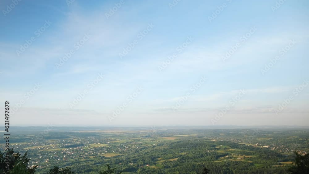 Panoramic view of beautiful summer mountains, small houses, roads at sunny day. Nature inspiration. Calming peace. Rural area on background mountain landscape. Destination for tourism and wanderlust Panoramic view of beautiful summer mountains, small houses, roads at sunny day. Nature inspiration. Calming peace. Rural area on background mountain landscape. Destination for tourism and wanderlust