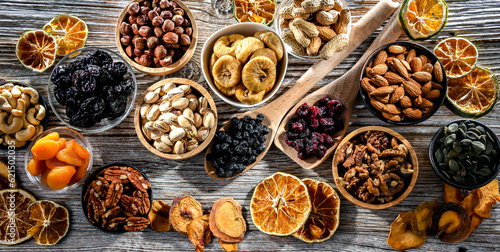 Composition with a variety of dried fruits and assorted nuts.