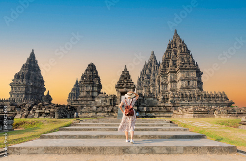 Woman traveler at Prambanan temple near Yogyakarta city, Central Java, Indonesia photo