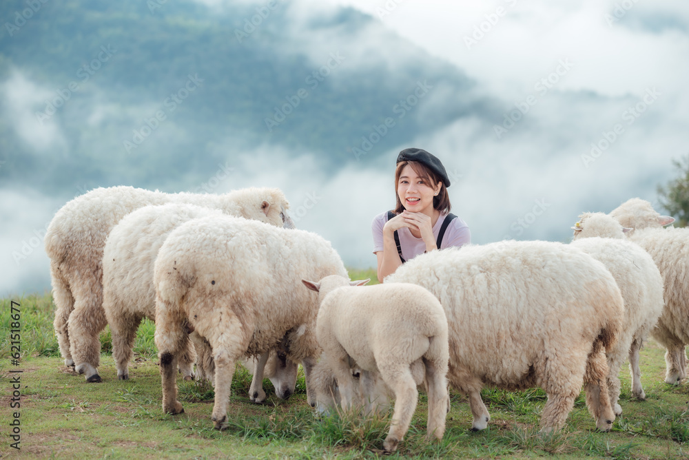 A happy moment of a female farmer and her sheep. A happy moment of a female farmer and her sheep.