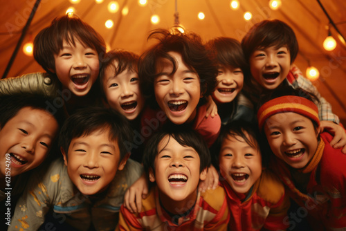 young Asian children having fun in a teepee. childhood, play, and interactive entertainment. magic, fantasy, and the endless imagination that arises in children's games