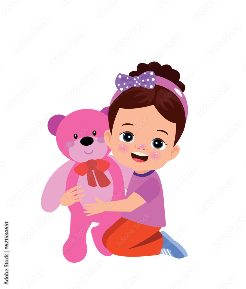 A boy is holding a teddy bear