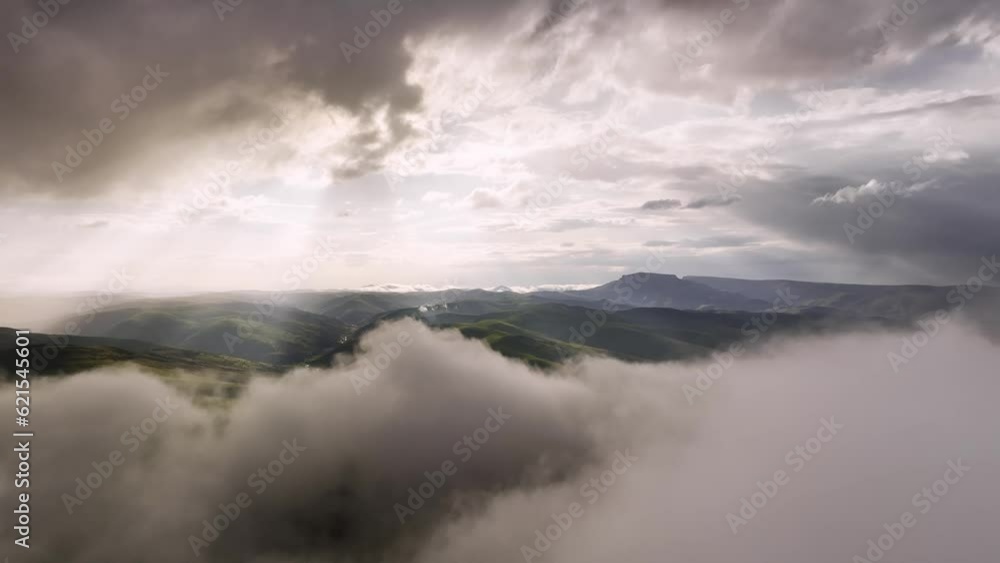 Aerial view timelapse of parallax clouds over a mountainous area. Videos summer mountain background Aerial view timelapse of parallax clouds over a mountainous area. Videos summer mountain background