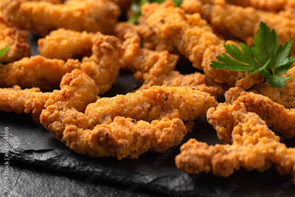 Crispy Shredded Chicken with sweet chilli sauce served on black slate. Party finger food snack concept Crispy Shredded Chicken with sweet chilli sauce served on black slate. Party finger food snack concept