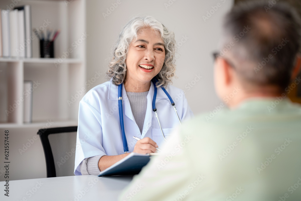Female doctor writing prescription on clipboard while explaining medicine use and discussing about