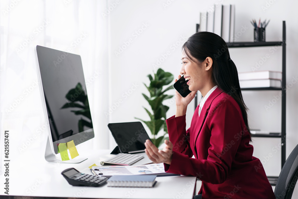 Businesswoman in suit using smartphone to talking with colleague Businesswoman in suit using smartphone to talking with colleague