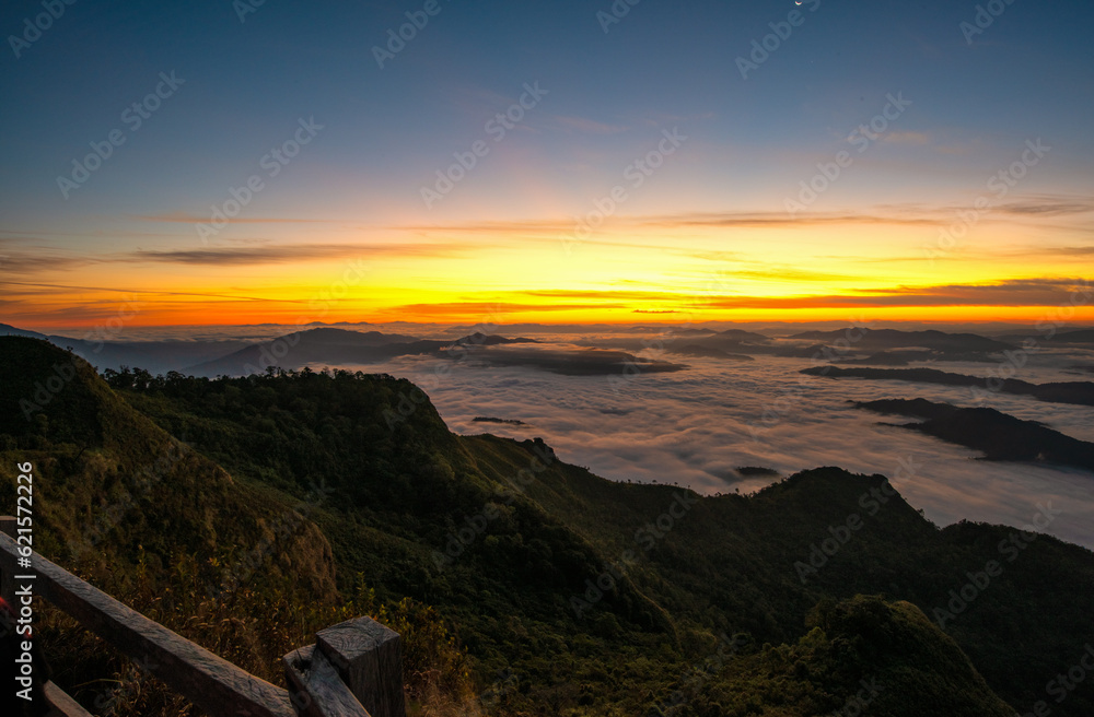 Fototapeta premium Aerial top view High mountain in morning time. Beautiful natural landscape Beautiful Sunrise Natural view on the hill, sea fog