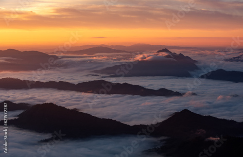Aerial top view High mountain in morning time. Beautiful natural landscape Beautiful Sunrise Natural view on the hill, sea fog © boygek