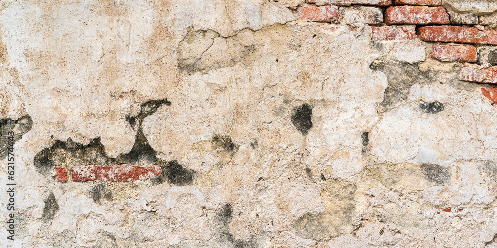 Fototapeta premium Old brick wall with plaster peeling off, grunge background. concrete for editing text on blank spaces, backdrops, banners, abstracts.